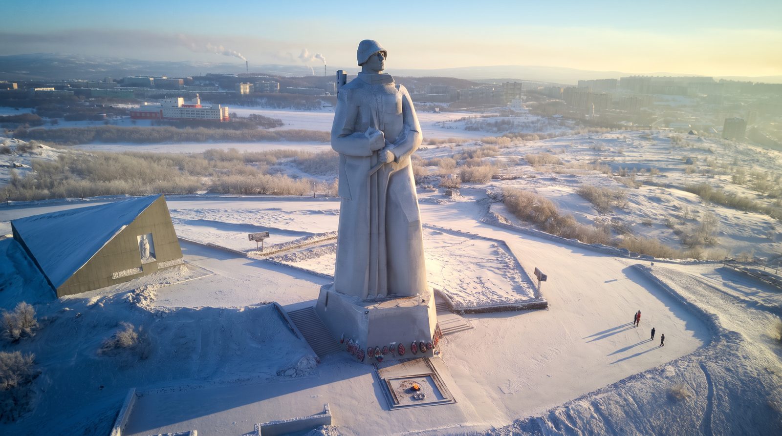 Soviet-era monument overlooking an Arctic port